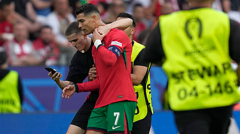 Ronaldo with pitch invaders