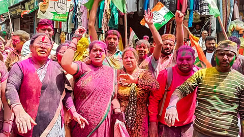 Congress workers celebrate after party's victory in Uttarakhand Assembly by-elections