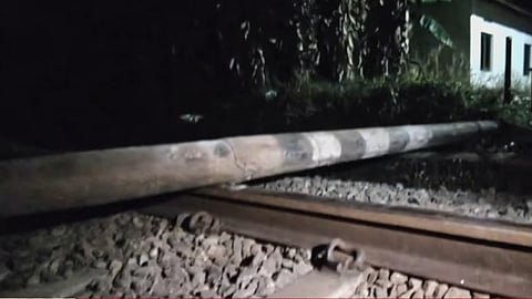 Electric post across railway track in Kundara