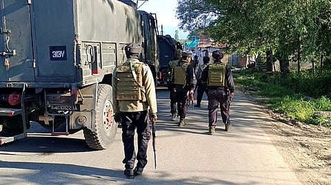 Security personnel undertake a cordon and search operation