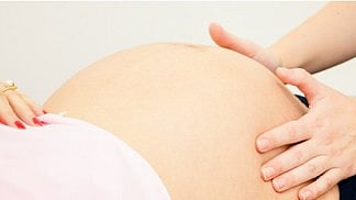 A piece of cloth was found on the body of a woman who had just given birth