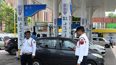Traffic Police personnel keep a vigil at a petrol pump after fuel ban for end-of-life vehicles under the directions of Commission for Air Qua