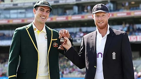 Pat Cummins and Ben Stokes with the Ashes trophy