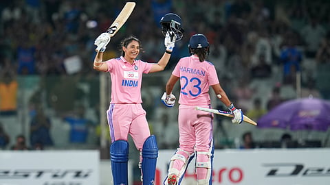India's Smriti Mandhana, celebrates her century with captain Harmanpreet Kaur