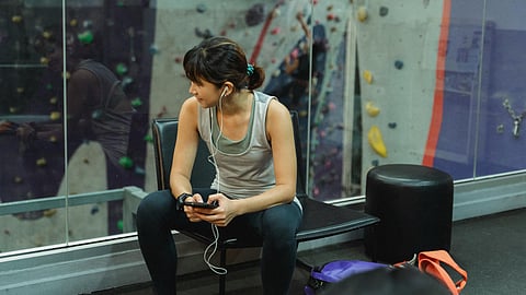 Woman using earbuds