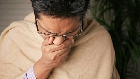 man sneezing