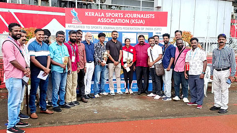 Niveth Krishna and Aditya Aji with Olympian PR Sreejesh with the award for best actors