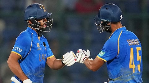United Arab Emirates' Sohaib Khan and United Arab Emirates' Aryansh Sharma greet each other during the T20 World Cup cricket match
