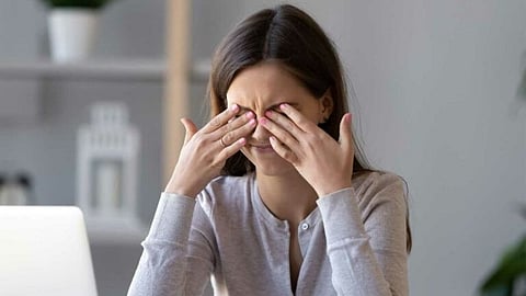 rubbing eyes