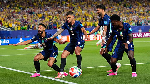 Brazilian players celebrate a goal