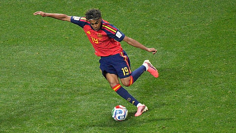Spain's Lamine Yamal (19) moves the ball during the World Cup