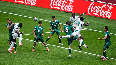 Senegal's Abdoulaye Seck, second from left, heads at goal before teammate Habib Diarra scored during the World Cup Group I soccer match between Senegal and Iraq