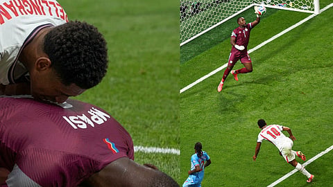 Congo goalkeeper Lionel Mpasi (1) saves from England's Jude Bellingham (10) during the World Cup round of 32 soccer match between England and Congo