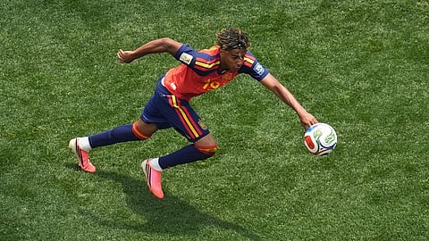 Spain's Lamine Yamal goes for the ball during the World Cup round of 32 soccer match between Spain and Austria