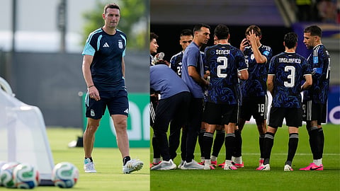 Argentina head coach Lionel Scaloni walks across the pitch during training for the World Cup soccer tournament