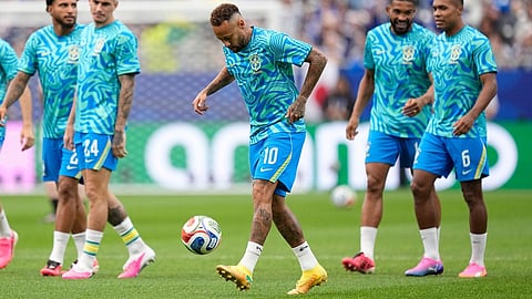 Brazil's Neymar (10) plays with the ball before the World Cup round of 32 soccer match