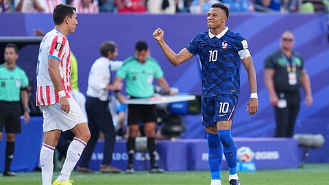 France's Kylian Mbappe (10) celebrates after scoring from a penalty kick the opening goal during the World Cup round of 16 soccer match between Paraguay and France