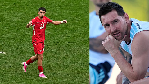 Argentina's Lionel Messi watches training for the World Cup soccer tournament