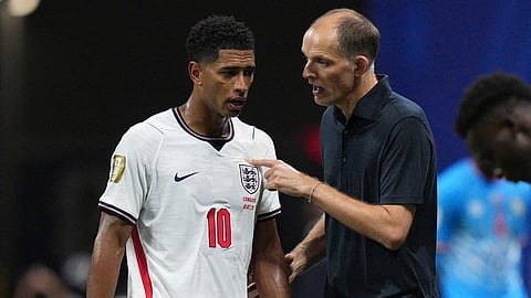 England head coach Thomas Tuchel talks to England's Jude Bellingham (10) during the World Cup round of 32 soccer match between England and Congo