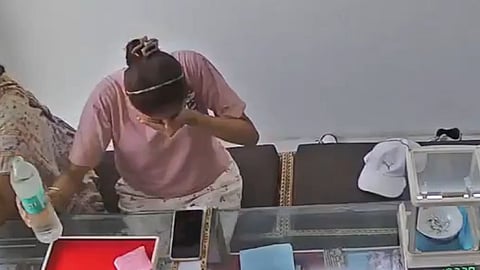UP Woman Takes Gulp Of Water From Bottle At Shop