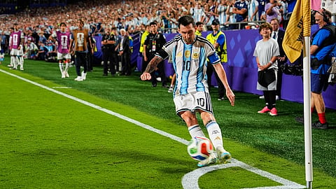 Argentina's Lionel Messi (10) takes a corner kick during the World Cup quarterfinal soccer match against Switzerland in Kansas City