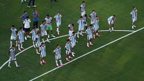 Argentina players stand during medal ceremony after the World Cup final soccer match between Spain and Argentina