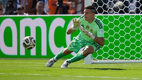 Argentina goalkeeper Emiliano Martinez (23) makes a save during the World Cup final soccer match between Spain and Argentina