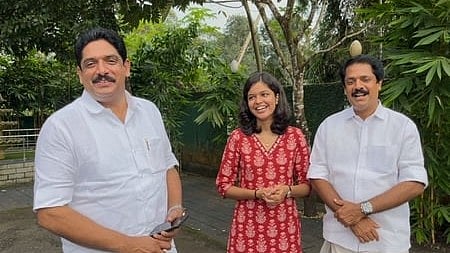 Binu Pulikkakandam (extreme left), daughter Diya Binu and his brother Biju Pulikkakandam at their residence in Pala