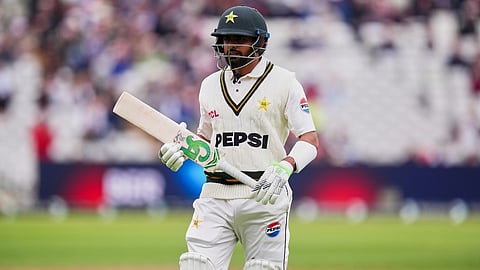 Pakistan's Babar Azam, leaves the pitch, after a wicket taken by England's Josh Tongue, during day one of the third cricket test match between England and Pakistan, at Edgbaston