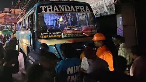 Accident as private bus rams onto footpath; 5 people trapped under the bus.