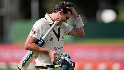 Australia's captain Pat Cummins reacts as he walks off the field after his dismissal on day five of the second cricket test match between South Africa and Australia, in Gqeberha