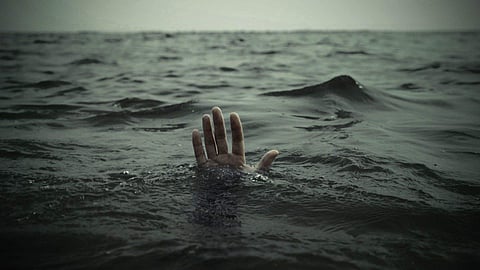 young man drowning