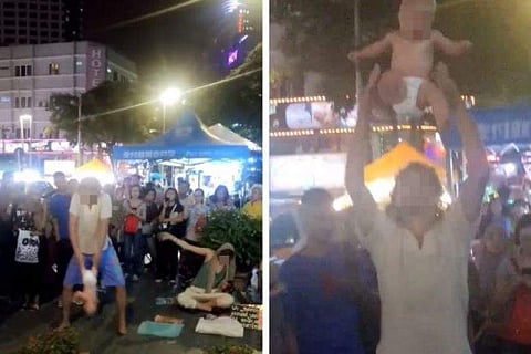 ഞങ്ങള് ലോകം ചുറ്റാന് പോവുകയാണ്, പണം വേണം: നാലുമാസം പ്രായമുള്ള കുഞ്ഞിനെക്കൊണ്ട് തെരുവില് സര്ക്കസ്