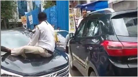 ബോണറ്റിലിരുന്ന പൊലീസുകാരനെയും കൊണ്ട് കാര് ഓടിച്ചുപോകുന്നതിന്റെ വീഡിയോ ദൃശ്യം