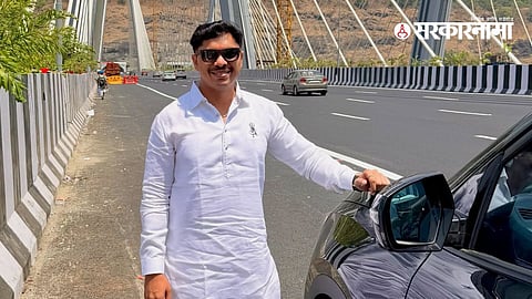 Pimpri-Chinchwad mayor Ravi Landge clicks photos on Mumbai-Pune Expressway bridge, sparking controversy over traffic rule violation.