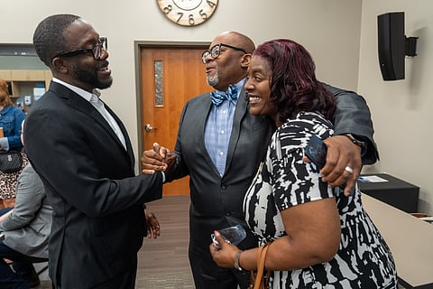 Quentin Hart, left, former mayor of Waterloo, shakes hands with Trent Keller, both of which spoke at the Thrive Iowa of Black Hawk County launch on June 25, in Waterloo, Iowa.