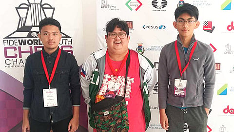 LEAN TEAM. From left, Fide master (FM) Mark Jay Bacojo, arena grandmaster Almario Marlon Quiroz Bernardino Jr., head of delegation and coach), and Panabo City's FM Christian Gian Karlo Arca pose in a photo opportunity.