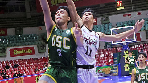 LAYUP. USC guard Uriel Avila slips past the UP-Cebu defense for a layup in their game in the Cebu Schools Athletic Foundation Inc. (Cesafi) men’s basketball tournament on Tuesday evening, Nov 14, 2023 at the Cebu Coliseum.
