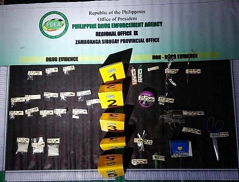 ZAMBOANGA. Operatives of the Philippine Drug Enforcement Agency backed by policemen and soldiers arrest four suspects and seize close to P150,000 worth of illegal drugs as they dismantle a drug den in a law enforcement operation at Purok Magsasaka in Poblacion village, Titay, Zamboanga Sibugay on Thursday, January 25. A photo handout shows the pieces of evidence seized during the law enforcement operation.