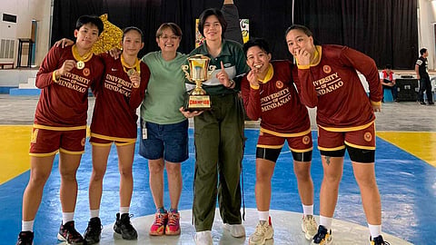 WE ARE THE CHAMPIONS. The University of Mindanao (UM)-A Lady Wildcats, coached by veteran Crisanthemum “Ining” Sarabia, wins the women's 3x3 championship trophy in the National University Games (Uni-Games) 2024 basketball competition at the Jose Rizal Memorial State University (JRMSU) on Tuesday, January 23, 2024. UM-A defeated Polytechnic University of the Philippines (PUP)-A, 15-13, in their gold medal match.