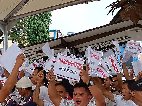 RALLY VS CHA-CHA. Protesters from Calinan District express disapproval of the People's Initiative for Charter Change by chanting, "Dabawenyos are not for sale." They raise flaglets with the same message at Rizal Park, Davao City, on January 19, 2024