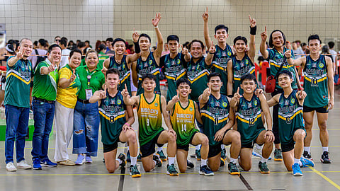 NUMBER 1. The victorious Davao City secondary boys' volleyball team players, coaches, and officials proudly display the number one sign after clinching the gold medal in the Davao Region Athletic Association (Davraa) Meet 2024 volleyball competition at the Davao City-University of the Philippines (DC-UP) multi-purpose gym at UP Mindanao on Saturday, April 6.