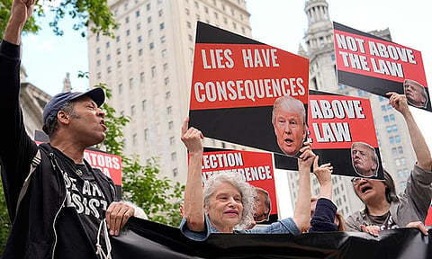 People react to the guilty verdict announced against former President Donald Trump outside Manhattan Criminal Court, Thursday, May 30, 2024, in New York. Donald Trump became the first former president to be convicted of felony crimes as a New York jury found him guilty of 34 felony counts of falsifying business records in a scheme to illegally influence the 2016 election through hush money payments to a porn actor who said the two had sex.