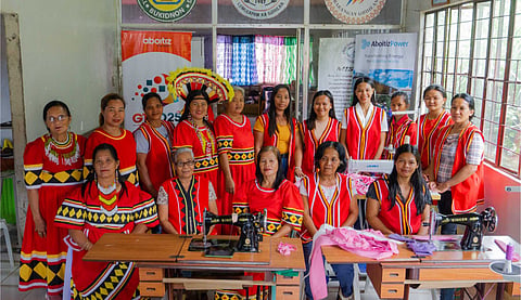 SEWING A BRIGHTER FUTURE. Women from the Guihean IP Women's Association in Bukidnon, proudly showcase their new sewing skills, ready to transform their community’s economic landscape.