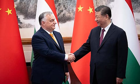 In this picture issued by the Hungarian Prime Minister's Press Office, Hungarian Prime Minister Viktor Orban, left, and Chinese President Xi Jinping shake hands before a meeting in Beijing, China, Monday, July 8, 2024.