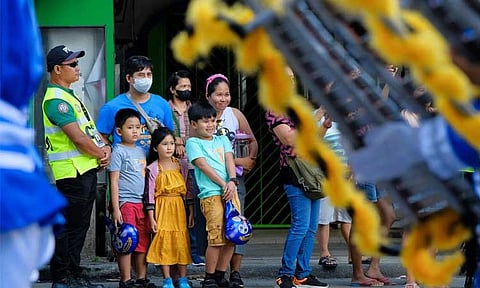 'DISCIPLINED FAMILY.' The "Pamilyang Dabawenyo, Disiplinado" bagged this year's first-place award for the Hulagway sa Araw ng Dabaw 2024. The photo by Excelsio Hiponia Jr. depicted a family that stayed within the designated area and was excitedly watching the parade during the Parada Dabawenyo Event. It also shows the marshal’s efforts in keeping the area organized for the convenience of the families and other spectators and for them to fully enjoy the parade.