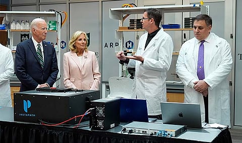 President Joe Biden and first lady Jill Biden listen during a demonstration of cancer research and detection techniques at Tulane University, Tuesday, Aug. 13, 2024, in New Orleans.