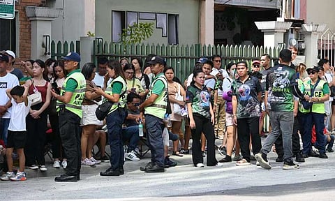 Safety and security personnel are seen patrolling the parade route of Pamulak and Indak-Indak sa Kadayawan along corner Bonifacio Street in Davao City, on Sunday morning, August 18, 2024.