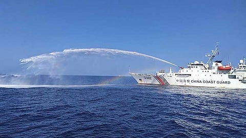 MANILA. In this file photo provided by the Philippine Coast Guard, a Chinese Coast Guard ship (right) uses its water cannons on a Philippine Bureau of Fisheries and Aquatic Resources (BFAR) vessel, as it approaches Scarborough Shoal in the disputed South China Sea, on December 9, 2023.