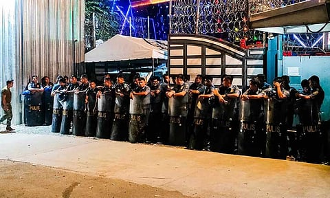 Police officers maintained a barricade outside the Kingdom of Jesus Christ (KOJC) Compound as of 11 p.m. on Tuesday, August 27, 2024.